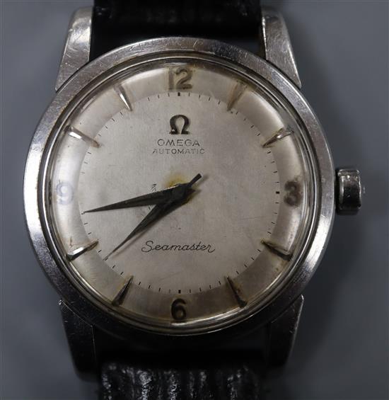 A gentlemans 1950s stainless steel Omega Seamaster automatic wrist watch, on associated leather strap, with Omega box.